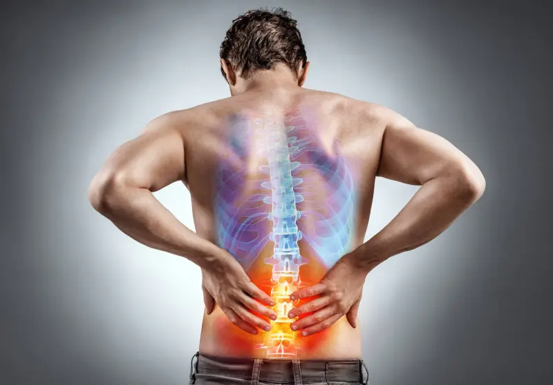 Lower back pain. Man holding his back in pain. Medical concept.